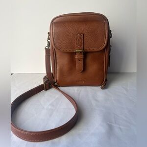 Minooy Naya small crossbody bag in brown leather.